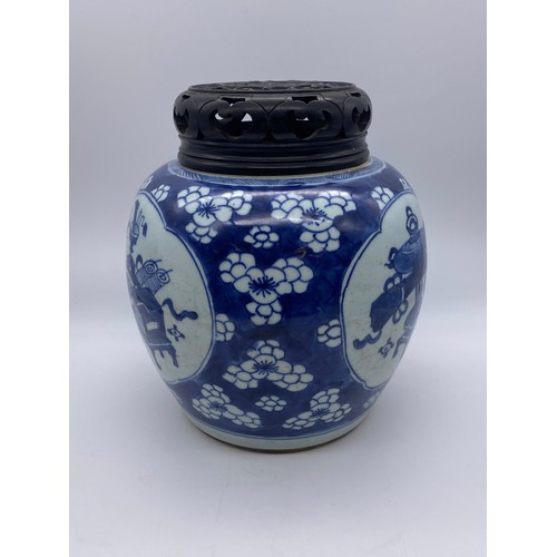 754 - CHINESE BLUE AND WHITE VASE WITH HARD WOOD COVER DECORATED WITH PANELS OF ATTRIBUTES ON PRUNUS FLORA... 