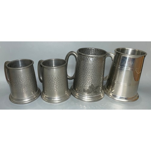 462 - THREE BEATEN PEWTER TANKARDS AND ONE PLAIN SELMARK PEWTER TANKARD