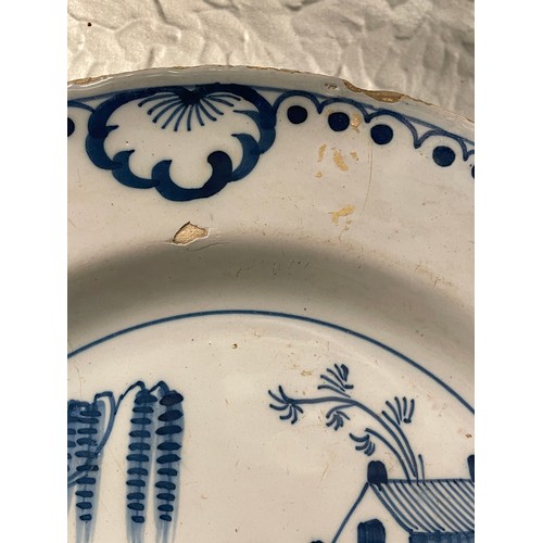 475 - TWO DELFT EARTHEN WARE BLUE AND WHITE PLATES