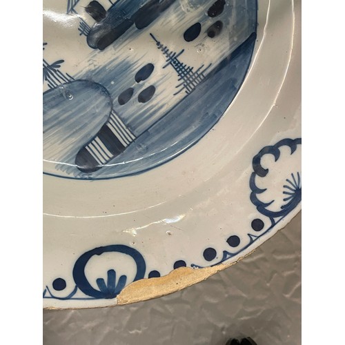 475 - TWO DELFT EARTHEN WARE BLUE AND WHITE PLATES