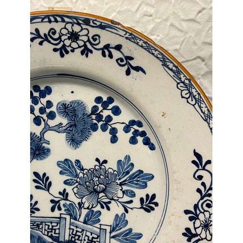 475 - TWO DELFT EARTHEN WARE BLUE AND WHITE PLATES