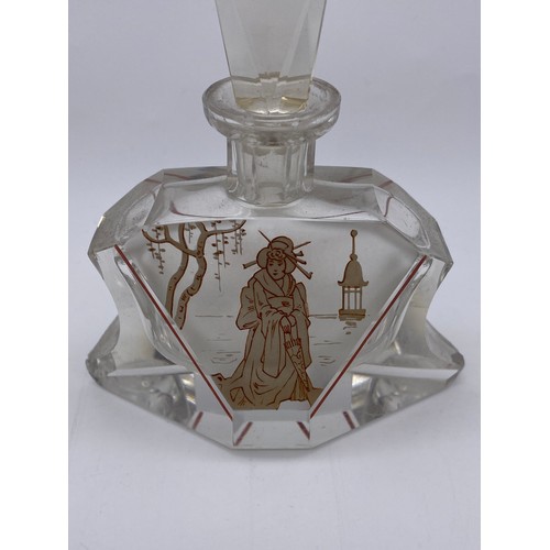 756 - ART DECO GLASS SHAPED SCENT BOTTLE DECORATED WITH A GEISHA