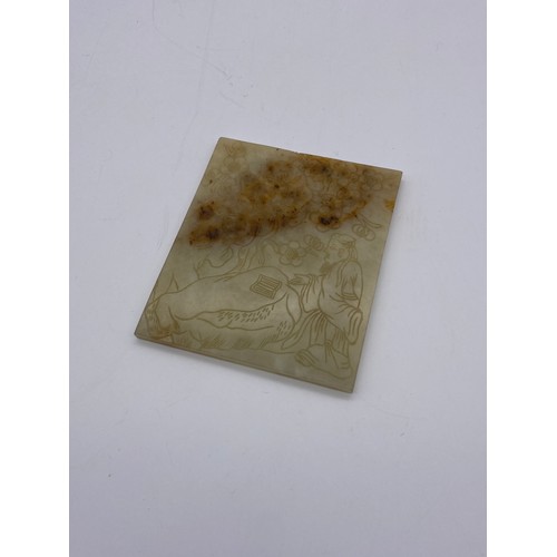 770 - CELADON JADE AND RUSSET TILE PANEL INCISED WITH A SCHOLAR AND FOLIAGE