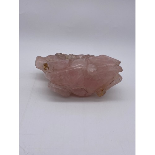 774 - CHINESE ROSE QUARTZ CARVING OF A BOY ASTRIDE A WATER BUFFALO ON STAND A/F