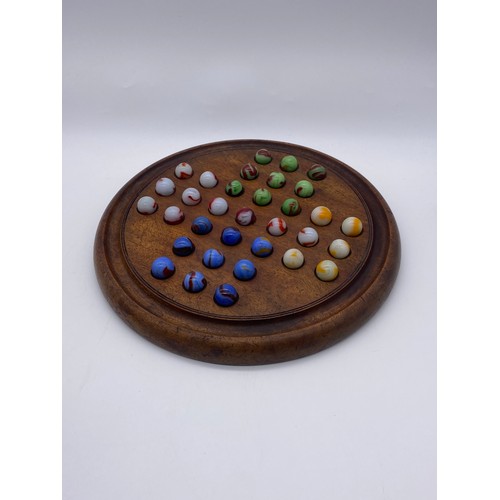 795 - SOLITAIRE BOARD AND SELECTION OF COLOURED GLASS MARBLES WITH SOME SPARES