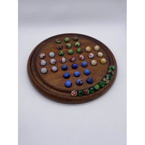 795 - SOLITAIRE BOARD AND SELECTION OF COLOURED GLASS MARBLES WITH SOME SPARES