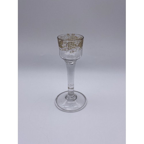 875 - 18TH CENTURY JACOBITE WINE GLASS WITH ETCHED GRAPE VINE DECORATION ON A FOLDED FOOT