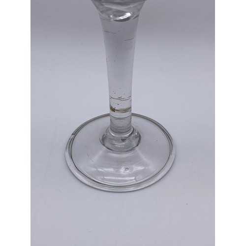 875 - 18TH CENTURY JACOBITE WINE GLASS WITH ETCHED GRAPE VINE DECORATION ON A FOLDED FOOT