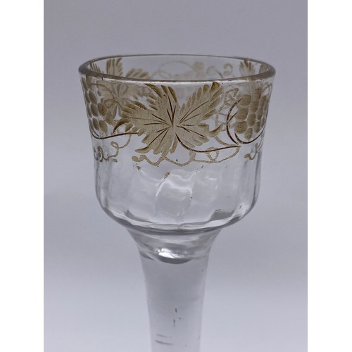 875 - 18TH CENTURY JACOBITE WINE GLASS WITH ETCHED GRAPE VINE DECORATION ON A FOLDED FOOT