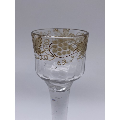 875 - 18TH CENTURY JACOBITE WINE GLASS WITH ETCHED GRAPE VINE DECORATION ON A FOLDED FOOT