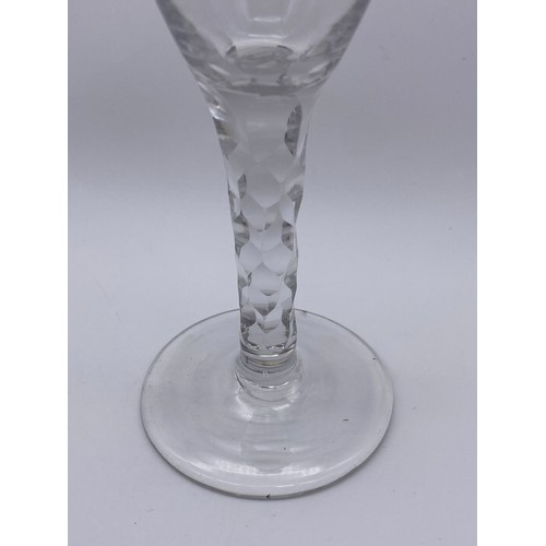 874 - TWO FACET CUT STEMMED WINE GLASSES AND A 19TH CENTURY GILT DECORATED WINE GLASS