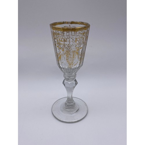 874 - TWO FACET CUT STEMMED WINE GLASSES AND A 19TH CENTURY GILT DECORATED WINE GLASS