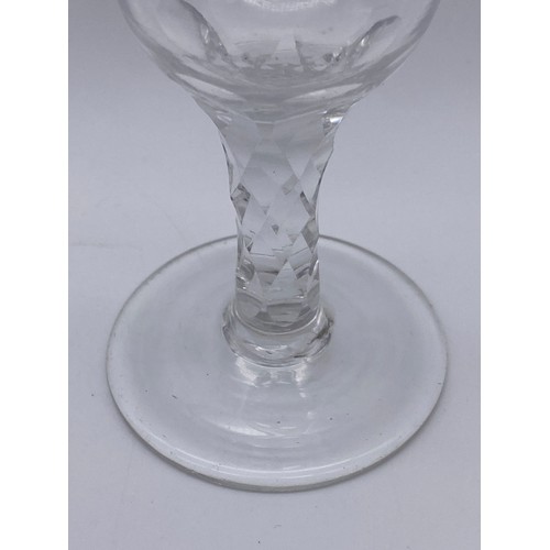 874 - TWO FACET CUT STEMMED WINE GLASSES AND A 19TH CENTURY GILT DECORATED WINE GLASS