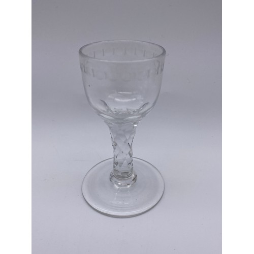 874 - TWO FACET CUT STEMMED WINE GLASSES AND A 19TH CENTURY GILT DECORATED WINE GLASS