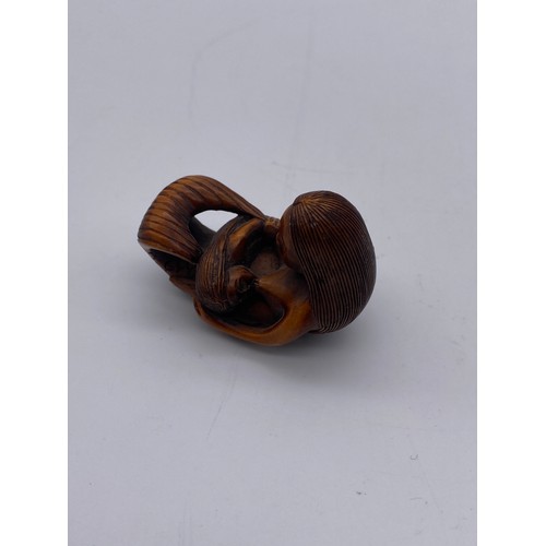 778 - JAPANESE BOX WOOD NETSUKE OF A MERMAID WITH CHILD