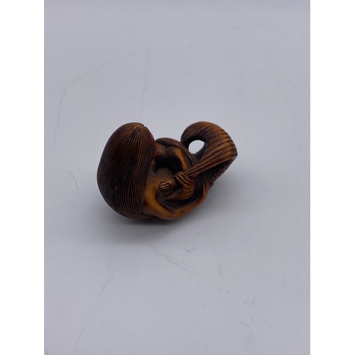 778 - JAPANESE BOX WOOD NETSUKE OF A MERMAID WITH CHILD