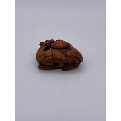 781 - JAPANESE BOX WOOD NETSUKE OF RECUMBENT CAMEL