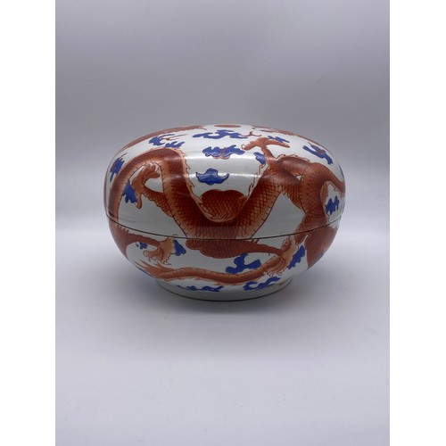 744 - JAPANESE CIRCULAR DOMED BOX AND COVER DECORATED WITH RED DRAGONS AMIDST CLOUDS 28cm D