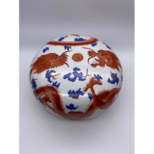 744 - JAPANESE CIRCULAR DOMED BOX AND COVER DECORATED WITH RED DRAGONS AMIDST CLOUDS 28cm D