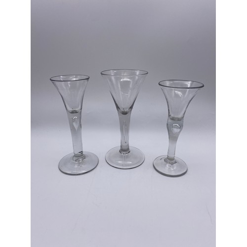 866 - THREE 18TH CENTURY PLAIN WINE GLASSES WITH TEAR DROP STEMS