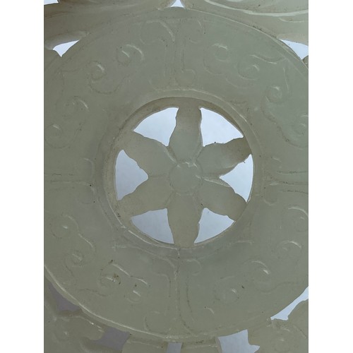767 - QING CELADON GREEN JADE CARVED RETICULATED WHEEL PANEL