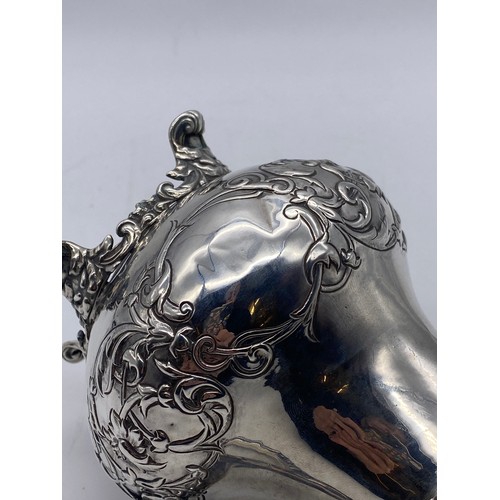 445 - GEORGIAN SILVER CREAM JUG WITH FOLIATE HANDLE 9.4 OZ APPROX