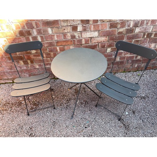 163 - FOLDING GREY METAL CIRCULAR PATIO TABLE AND TWO CHAIRS