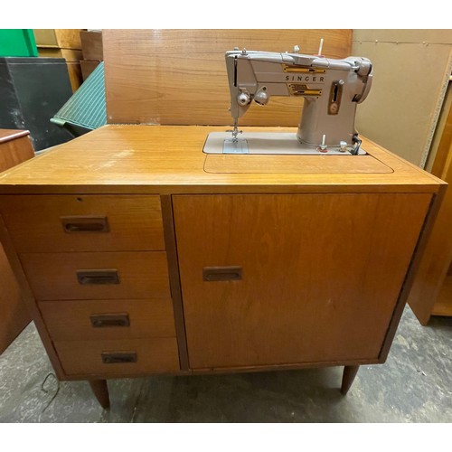 85 - TEAK CASED SEWING MACHINE CABINET AND CONTENTS