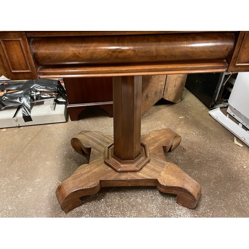 219 - WILLIAM IV MAHOGANY FOLD OVER GAMES TABLE ON A TAPERED OCTAGONAL COLUMN