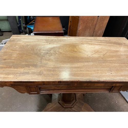 219 - WILLIAM IV MAHOGANY FOLD OVER GAMES TABLE ON A TAPERED OCTAGONAL COLUMN