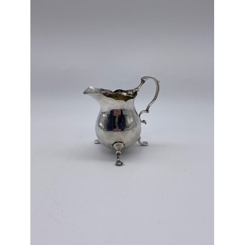 465 - GEORGIAN LONDON SILVER CREAM JUG WITH SCROLL HANDLE RAISED ON PAD FEET (MARKS INDISTINCT) 2.3OZ APPR... 