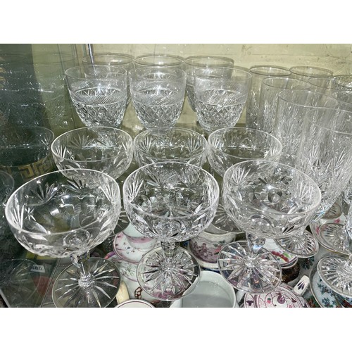 483 - SHELF OF GOOD QUALITY CUT GLASSWARE INC TALL WINES, CHAMPAGNE BOWLS, SQUARE SECTION DECANTERS AND TA... 