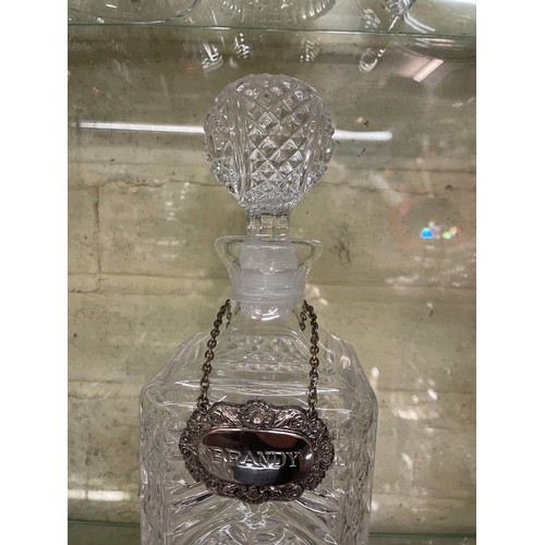 486 - SHIPS DECANTER AND STOPPER AND PAIR OF SQUARE SECTION DECANTERS WITH PLATED SPIRIT LABELS