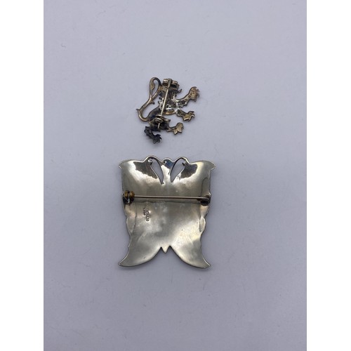 461A - SIAM SILVER NIELLO BUTTERFLY BROOCH AND STERLING SILVER LION RAMPANT BROOCH