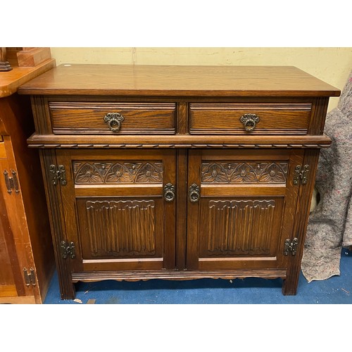 29 - CARVED OAK LINEN FOLD PANELLED SIDE CABINET