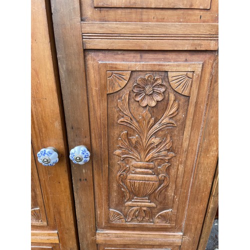 135 - SATIN WALNUT CARVED TWO DOOR CUPBOARD