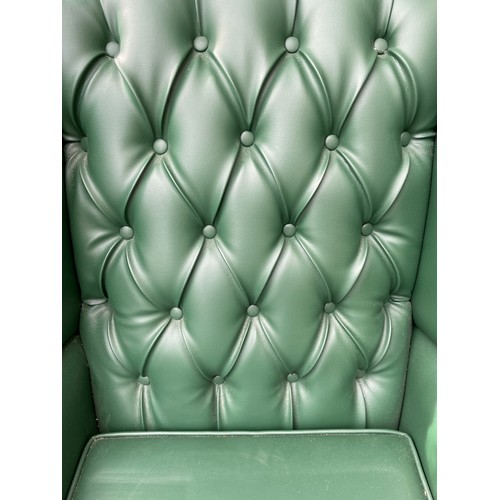 87 - RECOVERED GREEN BUTTON BACK WING ARMCHAIR