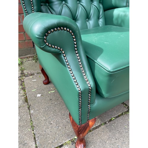 87 - RECOVERED GREEN BUTTON BACK WING ARMCHAIR