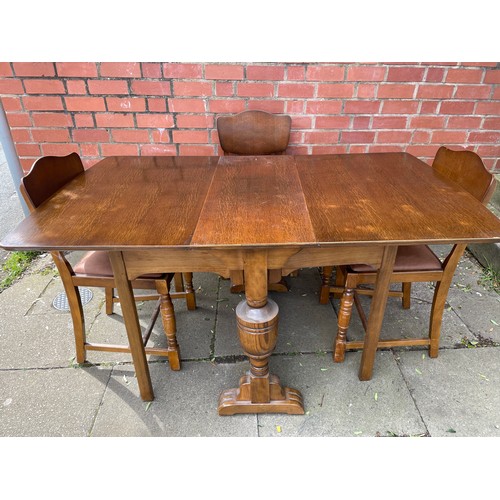 165 - OAK PLY DROP FLAP DINING TABLE WITH FOUR CHAIRS