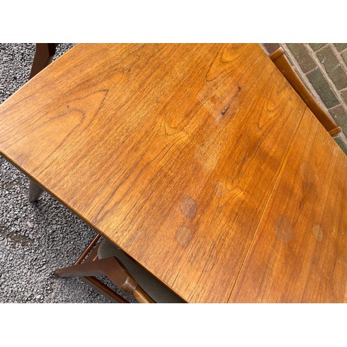 157 - 1960S TEAK EXTENDING DINING TABLE AND FOUR CHAIRS