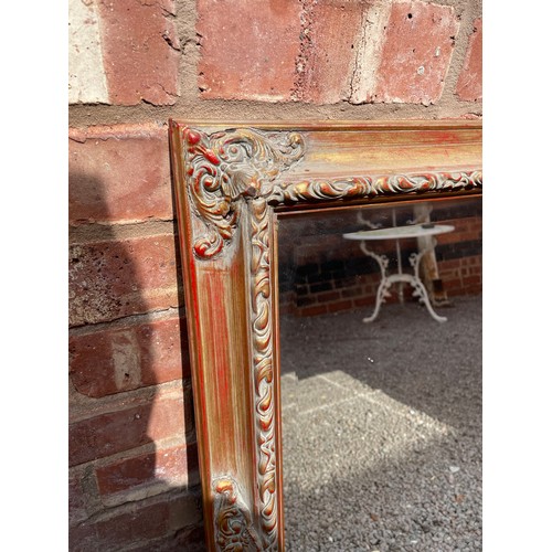 261 - GILT AND BURNISHED MOULDED FRAMED BEVELLED MIRROR