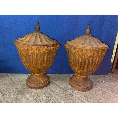 277 - PAIR OF NEO CLASSICAL CAST IRON FLUTED OVOID URNS WITH COVERS