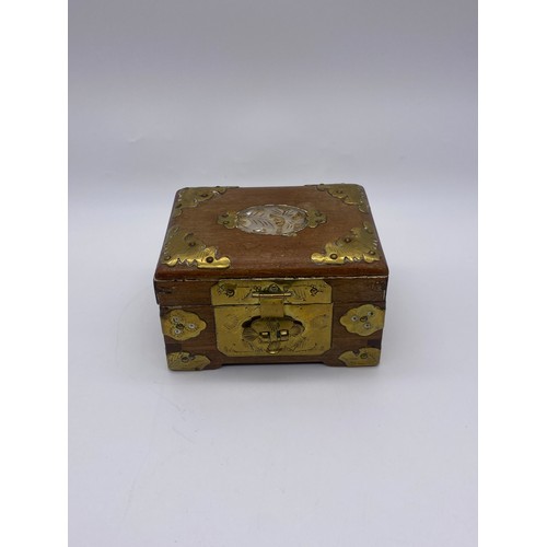 679 - CHINESE BRASS MOUNTED AND CARVED JEWELLERY CASKET