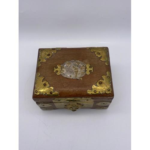 679 - CHINESE BRASS MOUNTED AND CARVED JEWELLERY CASKET