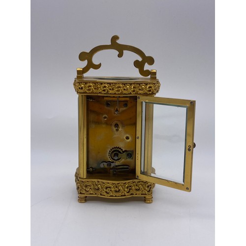 680 - QUALITY GILT ORMOLOU CHASED CASED CARRIAGE CLOCK WITH KEY