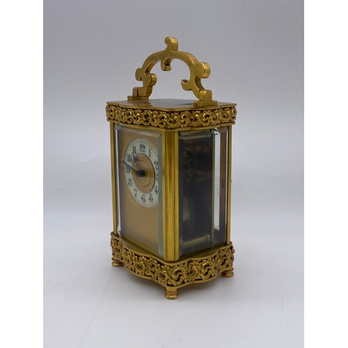 680 - QUALITY GILT ORMOLOU CHASED CASED CARRIAGE CLOCK WITH KEY