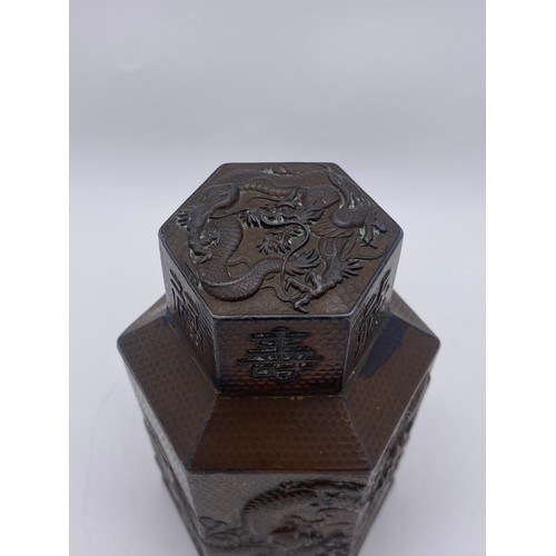 715 - JAPANESE HEXAGONAL COPPER PANELLED TEA CADDY DECORATED WITH CHASING DRAGONS