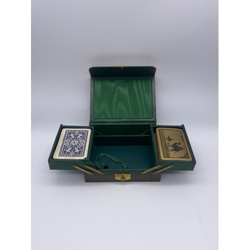 722 - GREEN LEATHER CANTILEVER CARD BOX AND DECKS OF CARDS