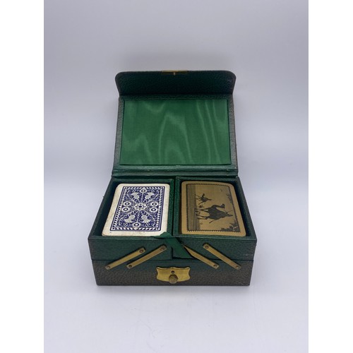 722 - GREEN LEATHER CANTILEVER CARD BOX AND DECKS OF CARDS