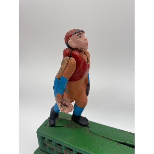 684 - CAST IRON PAINTED NOVELTY ‘HOME TOWN BATTERY' MONEY BANK